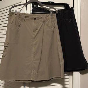Pair of size 10 Kuhl A-line waterproof skirts, khaki and gray, with pockets